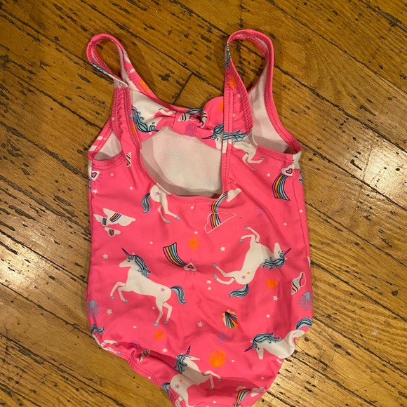 Oshkosh one piece unicorn and rainbow bathing suit in fluorescent pink. - Picture 2 of 3